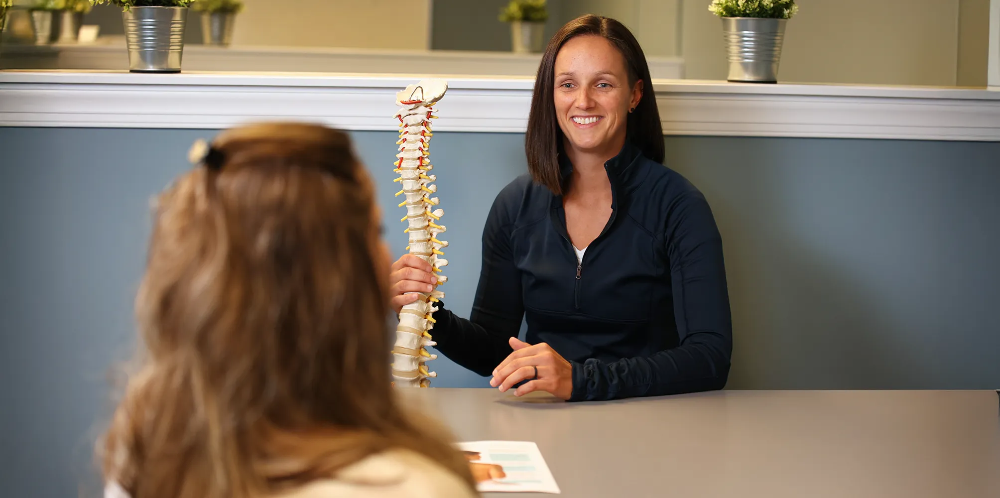 Chiropractor Concord NC Jen Doriott Consult with Patient Chiropractor Concord NC Jen Doriott Consult with Patient